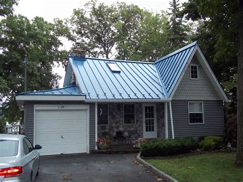 blue house with silver metal roof|colors for metal roof houses.